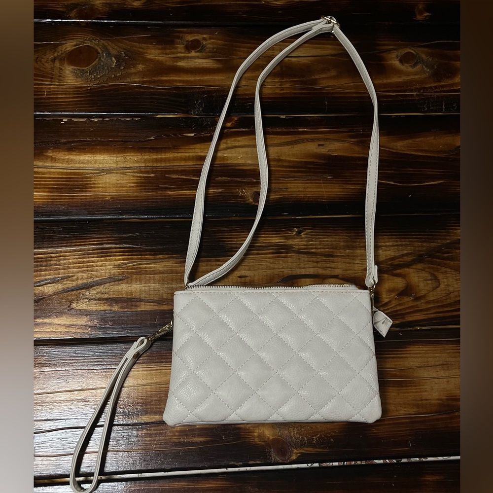 Cream cross body purse.